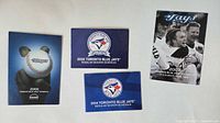 Front covers of four Toronto Blue Jays pocket schedules for 2004, 2006, 2014, 2016