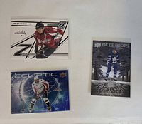 Fronts of three NHL trading cards showing Ovechkin Z-Team, Ovechkin Ecliptic and Matthews Deep Roots