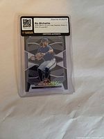 Front of Bo Bichette Obsidian Electric Etch Blue rookie card in MBA slab
