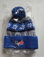 Front view showing Blue Jays logo, pom-pom and knit pattern