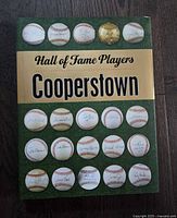 Front cover showing title and autographed baseball motif