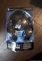 Front of sealed package showing headphones and branding