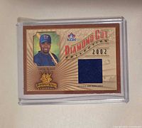 Front view of 2002 Donruss Diamond Cut jersey card showing player image, fabric swatch, Diamond Kings logo