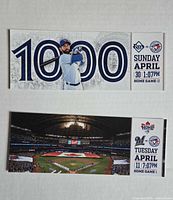 Two commemorative Blue Jays tickets laid flat showing event details and designs
