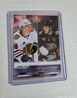 Front of 2023-24 Upper Deck Young Guns checklist card in top loader