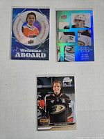 Fronts of three rookie hockey cards