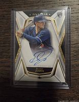 Front of autographed Danny Jansen rookie card in plastic holder