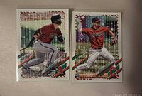 Front view of both Topps Holiday rookie cards in sleeves