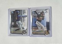 Front view of both Bowman Chrome 1st cards in sleeves