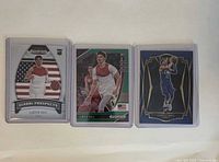 Front of three LaMelo Ball rookie cards in protectors