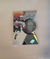 Front of Leo Carlsson Radiance FX rookie card showing action image and serial number 741/949