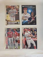 Front view of four Mike Trout Topps baseball cards