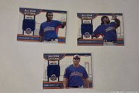 Overview of three All-Star Stitches jersey relic cards