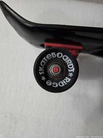 Close-up of Ridge branded wheel and truck assembly