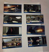 Fronts of eight Star Wars Episode I wide-format trading cards laid out