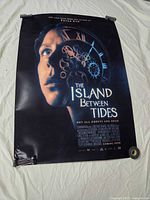 Full view of The Island Between Tides poster laid flat