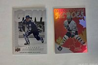 Front view of two Toronto Maple Leafs trading cards: Trilogy Generations Doug Gilmour and Hometown Heroes Darcy Tucker