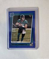 Front of Trevor Lawrence Rated Rookie Press Proof Blue card in holder