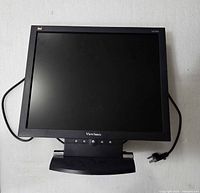 Front view of ViewSonic LCD monitor on stand with cords visible