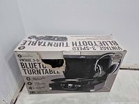 Front of retail box with product image and tear