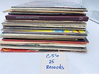 Stack of 25 LP records showing spines; visible spine text includes Nashville Graffiti II