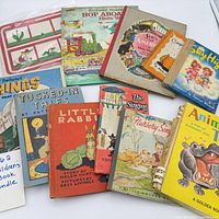 Group of ten vintage children’s books laid out showing covers