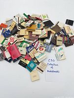 Pile of assorted matchbooks overview