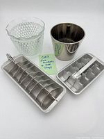 Group shot: glass ice bucket, stainless bucket, two aluminum trays