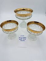 Full set of three gold-trim Kings Crown pedestal bowls