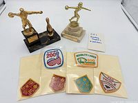 Overview of two trophies and six patches