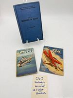 Three books laid out showing covers