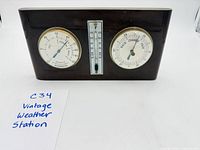 Front view showing all three gauges and wood case