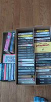 Overview of two boxes containing numerous cassette tapes