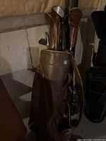Leather Campbell golf bag with clubs inside