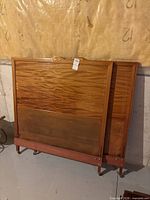 Front view of both headboards leaning against wall