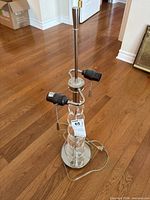 Full view of lamp showing stacked acrylic spheres and metal base