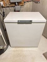 Front view of white chest freezer with closed lid