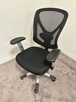 Front angled view showing mesh back, seat, armrests, base