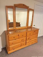 Six-drawer pine dresser with attached tri-fold mirror