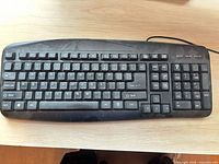 Top view of keyboard showing full key layout and attached cable