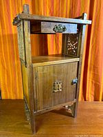 Full view of wooden smoking stand showing drawer, shelf, and cabinet