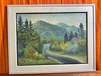 Full view of framed oil on board landscape painting