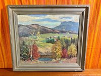 Full view of framed landscape painting