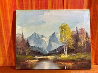 Full view of signed landscape painting on canvas