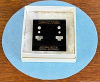 Black Swarovski display card with four crystal stud earrings