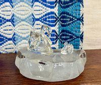 Large and small Swarovski crystal swans on glass base, overall view