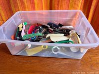 bin filled with assorted advertising shoe horns