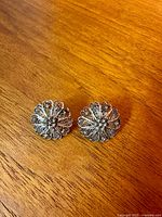Front view of both silver filigree earrings
