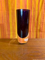 Front view showing amethyst body and clear base