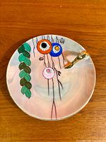 Top view of porcelain lemon server showing full painted design and handle